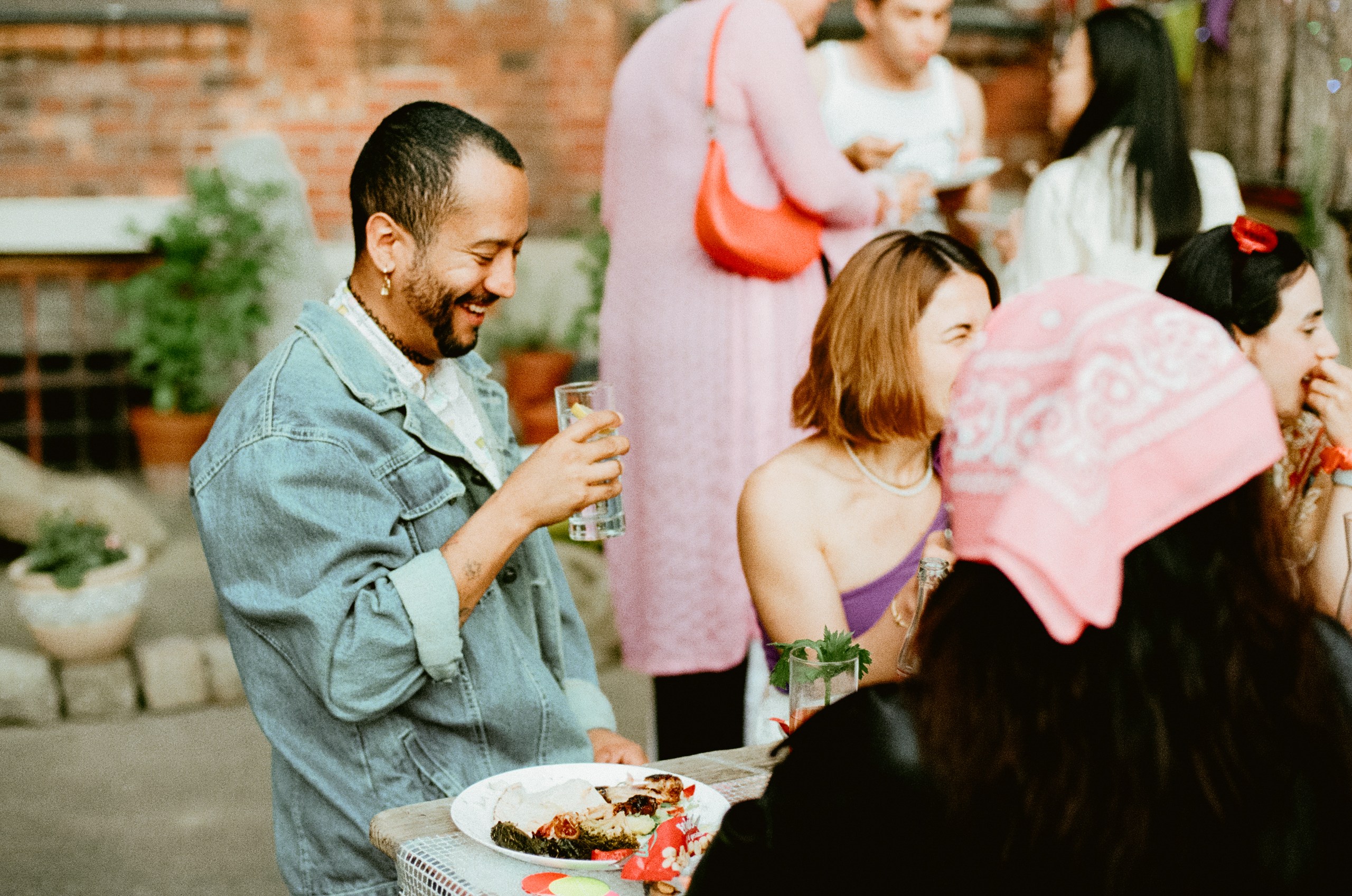 Guests laughing and enjoying the music at the AVOW 90s Summer Party 2024